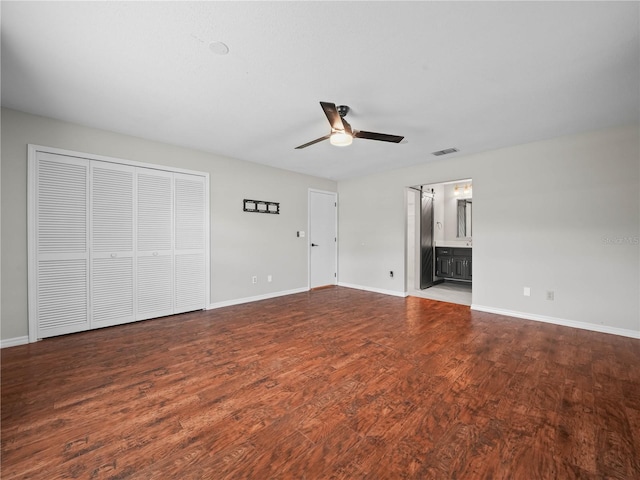 3002 Helms Dr, Auburndale, FL 33823 - unfurnished bedroom with baseboards, ceiling fan, dark wood-style flooring, and visible vents