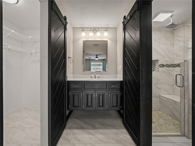 3002 Helms Dr, Auburndale, FL 33823 - full bathroom with vanity, a walk in closet, a stall shower, and marble finish floor