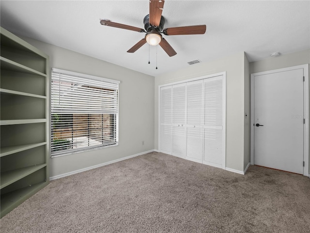 3002 Helms Dr, Auburndale, FL 33823 - unfurnished bedroom featuring visible vents, a ceiling fan, a closet, baseboards, and carpet flooring