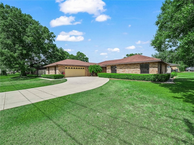 3002 Helms Dr, Auburndale, FL 33823 - ranch-style home with concrete driveway, an attached garage, and a front yard