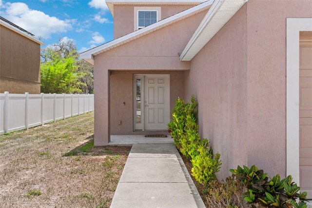 11 W Bay St, Davenport, FL 33837 - entrance to property with stucco siding