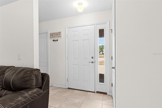 11 W Bay St, Davenport, FL 33837 - entrance foyer featuring light tile patterned flooring and baseboards