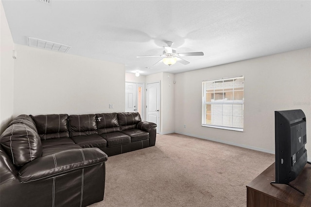 11 W Bay St, Davenport, FL 33837 - carpeted living area featuring ceiling fan and baseboards