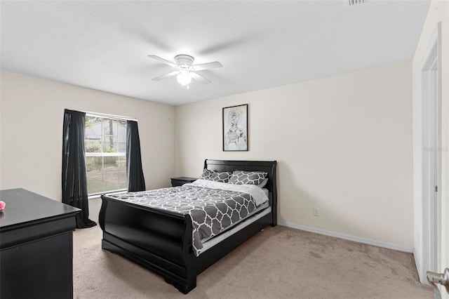 11 W Bay St, Davenport, FL 33837 - carpeted bedroom featuring baseboards and a ceiling fan