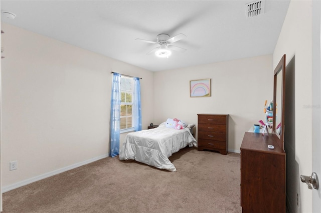 11 W Bay St, Davenport, FL 33837 - carpeted bedroom with baseboards and a ceiling fan