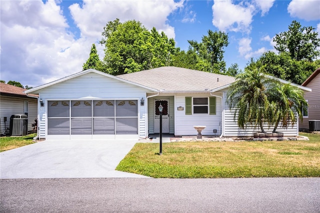 4976 Pleasant Hollow Trl, Lakeland, FL 33811 - single story home with an attached garage, central AC unit, a front lawn, and concrete driveway