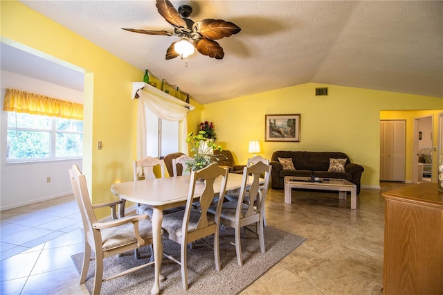 4976 Pleasant Hollow Trl, Lakeland, FL 33811 - dining space with ceiling fan, a textured ceiling, visible vents, baseboards, and lofted ceiling