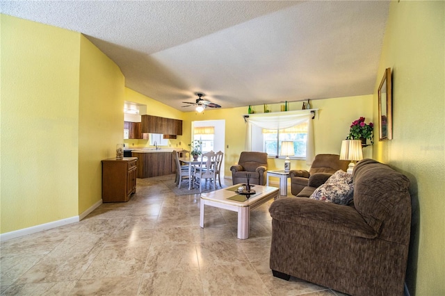 4976 Pleasant Hollow Trl, Lakeland, FL 33811 - living area featuring baseboards, a textured ceiling, ceiling fan, and lofted ceiling