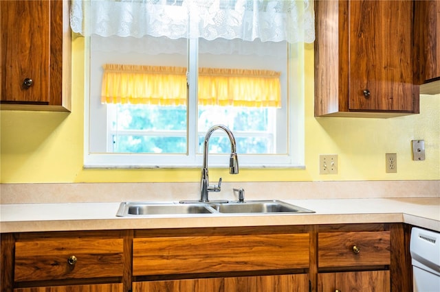 4976 Pleasant Hollow Trl, Lakeland, FL 33811 - kitchen with a sink, light countertops, and brown cabinets