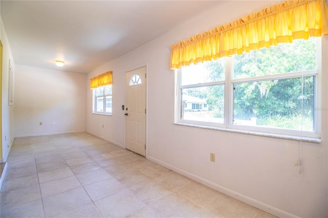 4976 Pleasant Hollow Trl, Lakeland, FL 33811 - entryway featuring baseboards and light tile patterned flooring