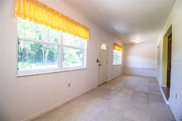 4976 Pleasant Hollow Trl, Lakeland, FL 33811 - entryway with baseboards and light tile patterned floors