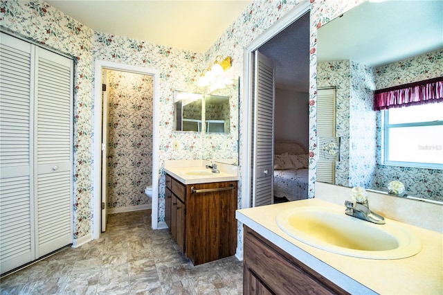 4976 Pleasant Hollow Trl, Lakeland, FL 33811 - full bathroom with toilet, wallpapered walls, a sink, and a closet