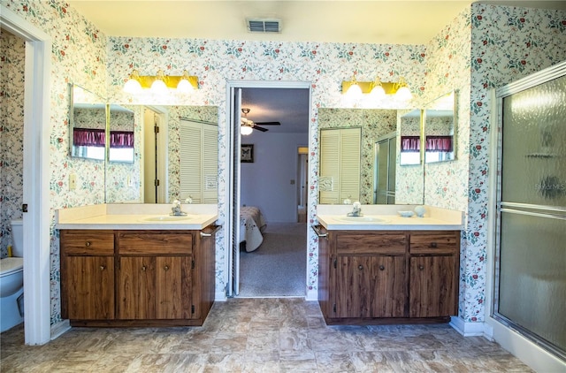 4976 Pleasant Hollow Trl, Lakeland, FL 33811 - bathroom with wallpapered walls, visible vents, and a sink