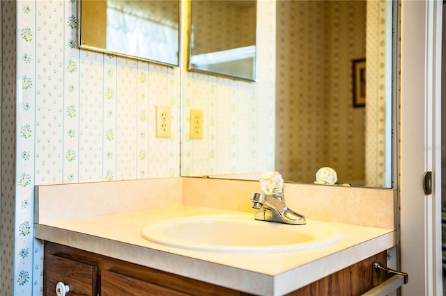 4976 Pleasant Hollow Trl, Lakeland, FL 33811 - bathroom with vanity and wallpapered walls