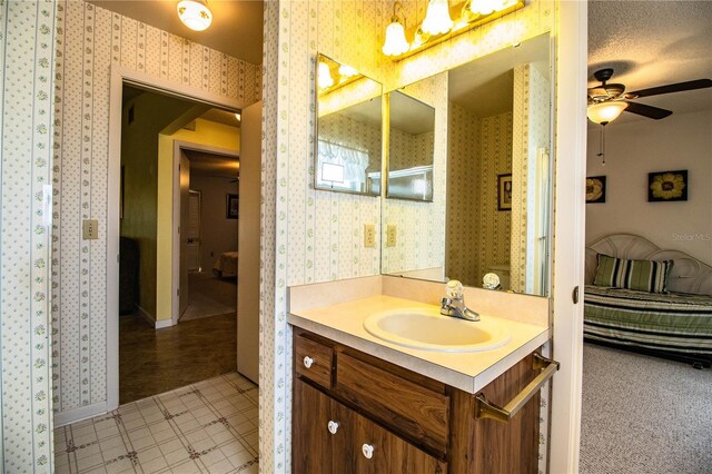 4976 Pleasant Hollow Trl, Lakeland, FL 33811 - bathroom featuring vanity, baseboards, ceiling fan, and wallpapered walls