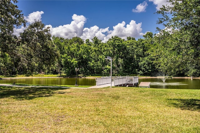 4976 Pleasant Hollow Trl, Lakeland, FL 33811 - view of home's community with a lawn, a water view, and a view of trees