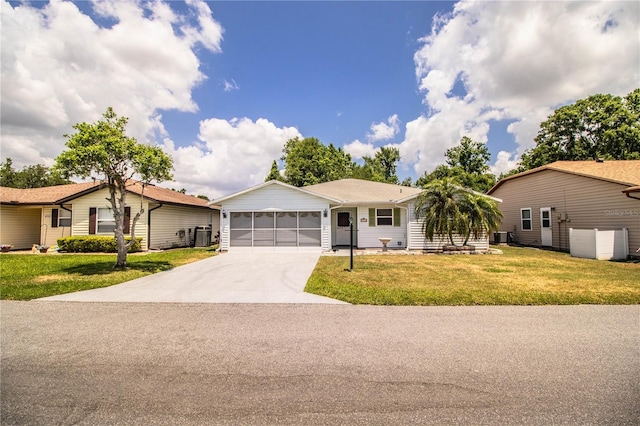 4976 Pleasant Hollow Trl, Lakeland, FL 33811 - single story home featuring a garage, central air condition unit, concrete driveway, and a front lawn