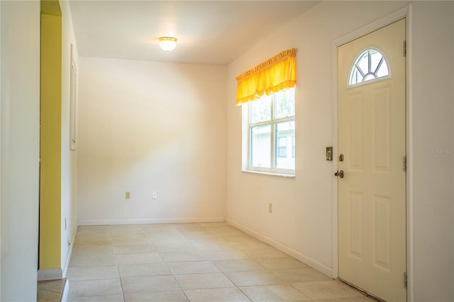 4976 Pleasant Hollow Trl, Lakeland, FL 33811 - foyer with light tile patterned flooring and baseboards