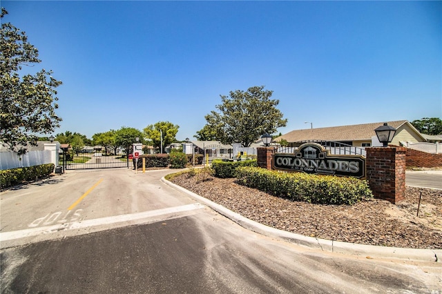 4976 Pleasant Hollow Trl, Lakeland, FL 33811 - view of street featuring street lights, a gated entry, a gate, and curbs