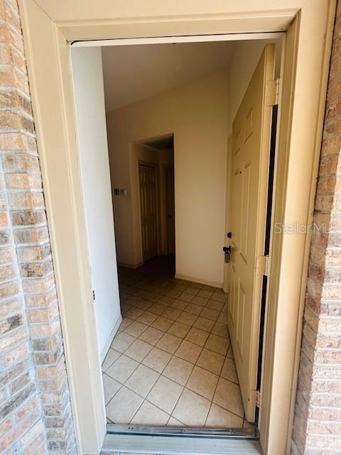 corridor with light tile patterned floors