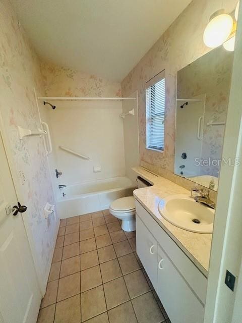 bathroom with vanity, tub / shower combination, toilet, wallpapered walls, and tile patterned floors