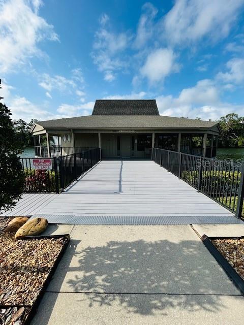 rear view of property with a fenced front yard