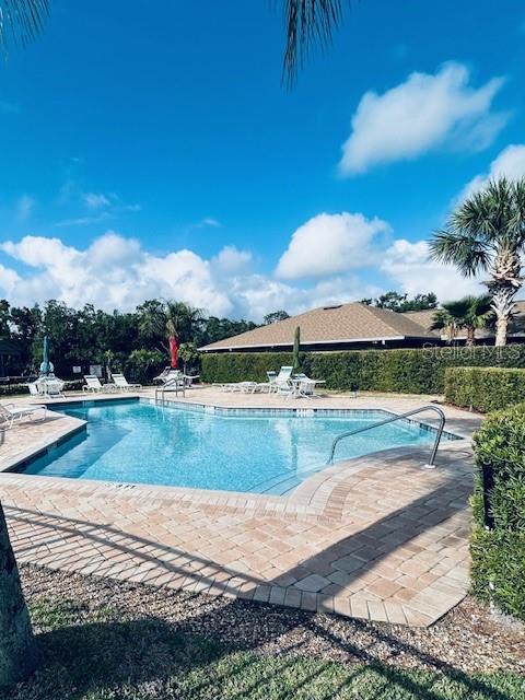 community pool featuring a patio area