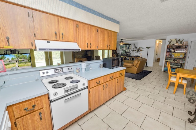 kitchen featuring black microwave, light countertops, white range with electric stovetop, and exhaust hood