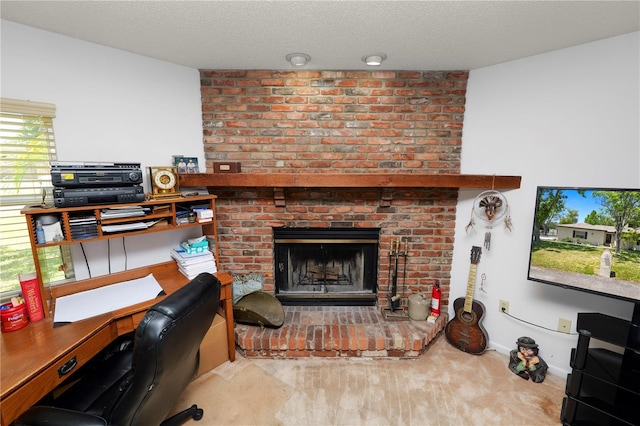interior space with a brick fireplace and a textured ceiling