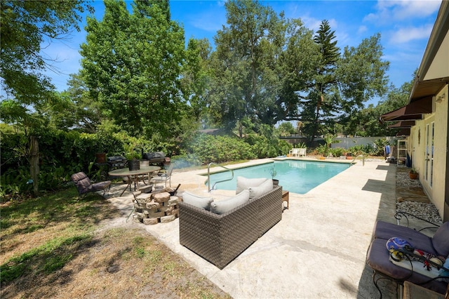 view of swimming pool with a fenced in pool, a fenced backyard, a patio area, and an outdoor living space