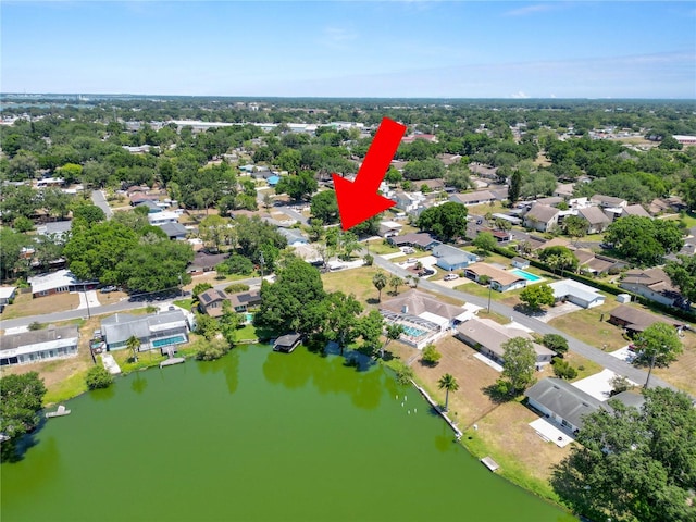 birds eye view of property with a residential view and a water view