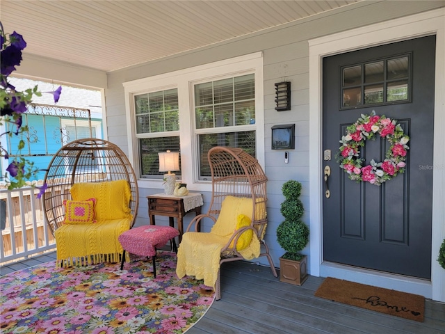 view of exterior entry featuring a porch