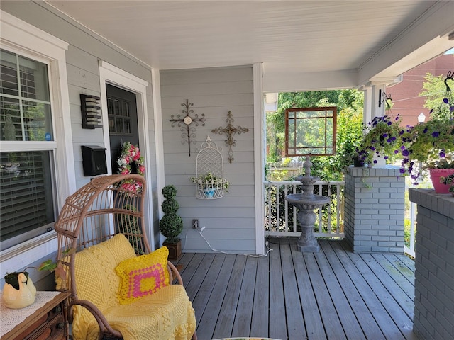 wooden terrace featuring a porch