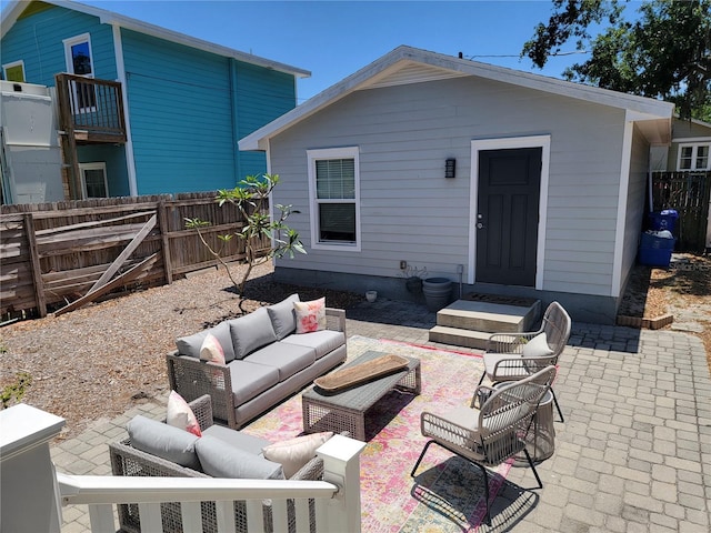 view of patio with an outdoor living space and a fenced backyard