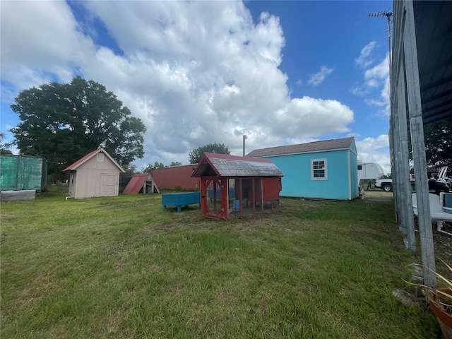 view of yard with an outdoor structure and exterior structure