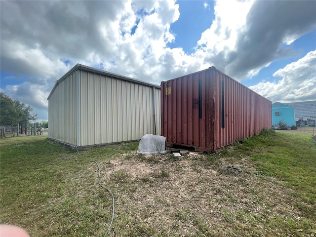 view of pole building with a lawn