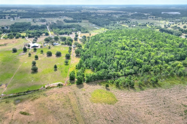 birds eye view of property featuring a rural view