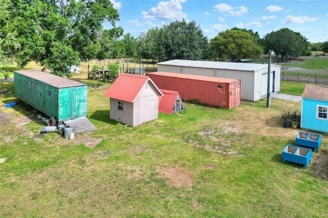 exterior space featuring a storage shed, a pole building, an outbuilding, and a detached garage