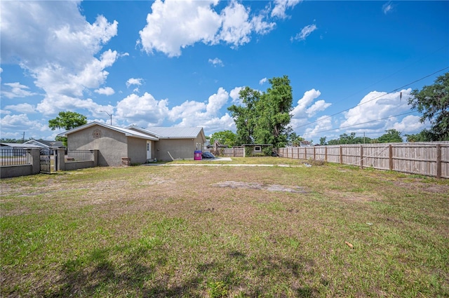 view of yard with a gate