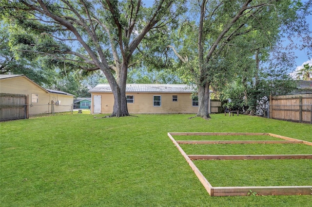 view of yard with a fenced backyard