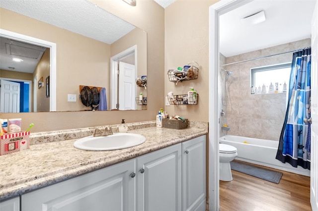 full bath with vanity, shower / bathtub combination with curtain, toilet, and wood finished floors