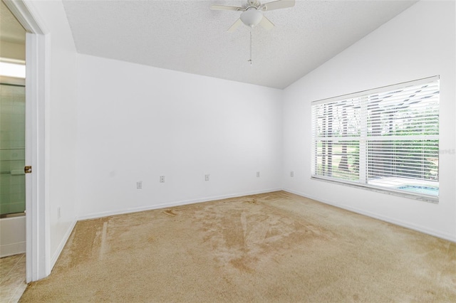 2660 Hemingway Ave, Haines City, FL 33844 - spare room with lofted ceiling, baseboards, ceiling fan, and carpet floors