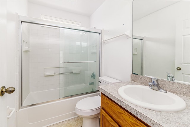 2660 Hemingway Ave, Haines City, FL 33844 - bathroom featuring toilet, vanity, and shower / bath combination with glass door