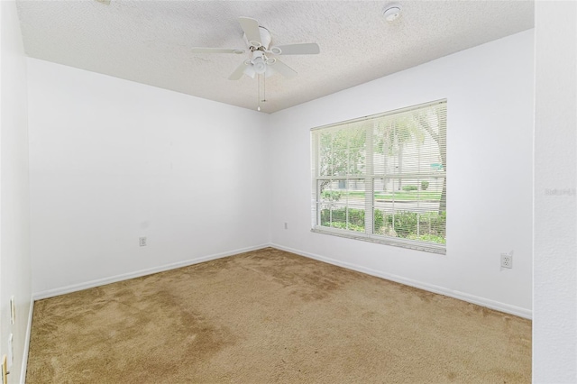 2660 Hemingway Ave, Haines City, FL 33844 - carpeted empty room featuring a textured ceiling, baseboards, and a ceiling fan