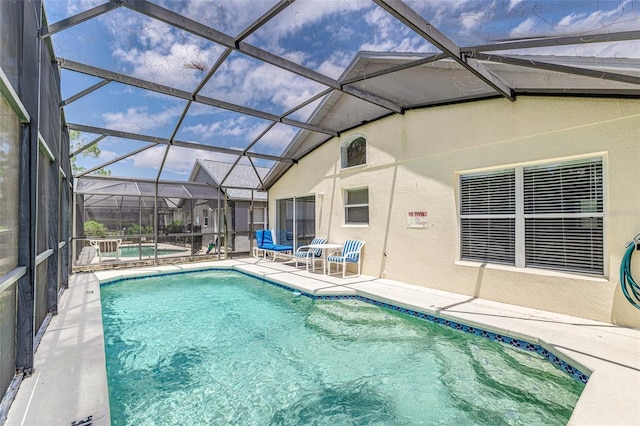 2660 Hemingway Ave, Haines City, FL 33844 - outdoor pool featuring a hot tub, a lanai, and a patio