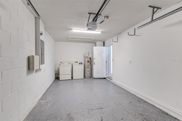 2660 Hemingway Ave, Haines City, FL 33844 - garage featuring electric panel, separate washer and dryer, electric water heater, a garage door opener, and concrete block wall