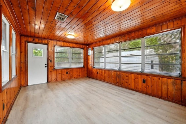 unfurnished sunroom with visible vents