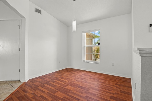 2812 Hickory Ridge Dr, Lakeland, FL 33813 - unfurnished dining area with baseboards, wood finished floors, and visible vents