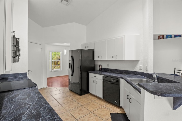 2812 Hickory Ridge Dr, Lakeland, FL 33813 - kitchen featuring visible vents, a sink, light tile patterned floors, white cabinets, and black appliances