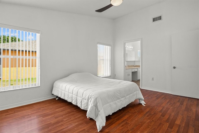 2812 Hickory Ridge Dr, Lakeland, FL 33813 - bedroom featuring baseboards, visible vents, wood finished floors, and ensuite bath